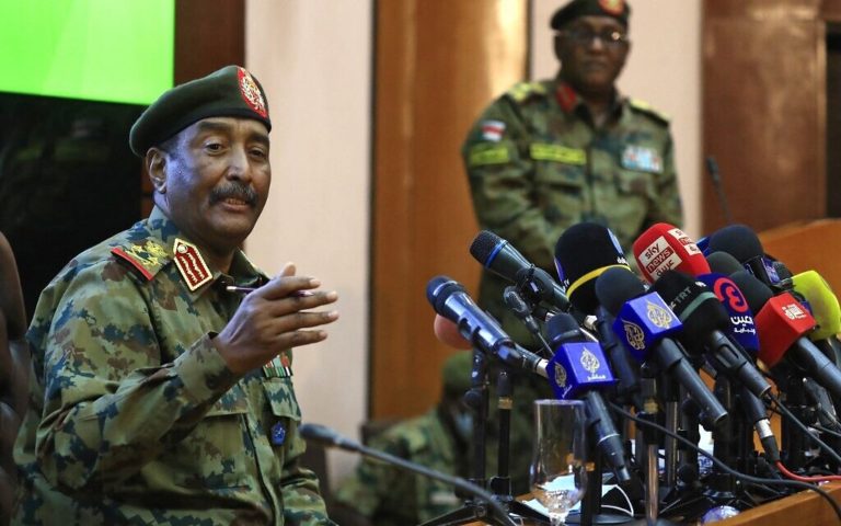 Sudanese army chief says PM not arrested, but staying with him