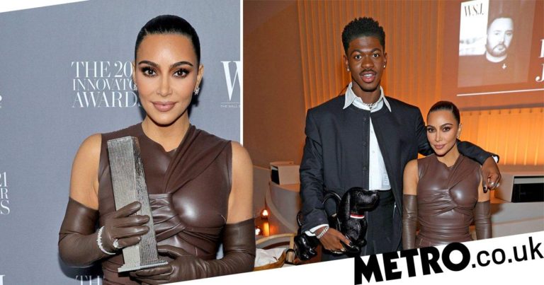 Kim Kardashian accepts innovator award in SKIMS brown leather dress