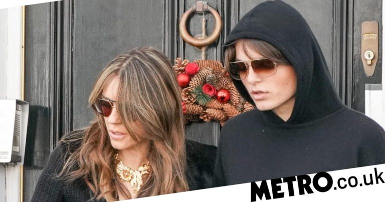 Elizabeth Hurley holds hands with son before ex Shane Warne’s funeral