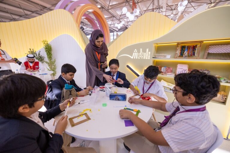 Children learn sustainability by making picture frames from waste materials at the 43rd Sharjah International Book Fair